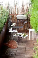 Small terrace garden with modern furniture designed by Antonino Sciortino. 
