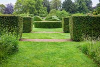 Clipped hedges of Fagus sylvatica - Beech and Taxus baccata - Yew in the Serpentine Garden at Scampston Hall Walled Garden, North Yorkshire, UK. 