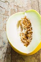 Yellow Melon cut open to show seeds and flesh