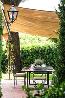 The living and dining area. Ferragamo garden, Tuscany, Italy.
