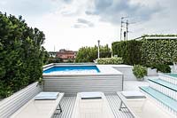 Modern terrace garden with swimming pool.