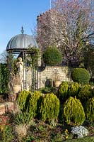 Cupola gazebo with statue of Pan, topiary nearby