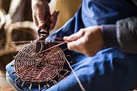 Basket making, cutting bare stems after weaving