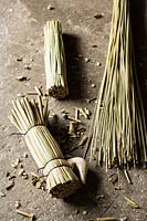 Bundles of grasses and wood for making wooden ornaments of ducks