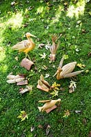 Collection of different birds and ducks carved from wood and grasses