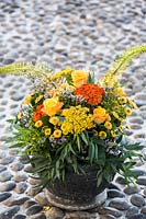 Bouquet of flowers with roses, Achillea, Solidago and chrysanthemums. 