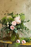 Floral bouquet in pinks, greens and white.