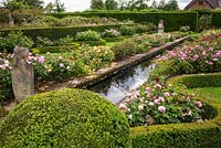 View along rill with roses and clipped hedges in The Renaissance Garden 
