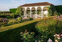 View over rose beds and hedge to the loggia in The Renaissance Garden 