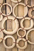 Bamboo design object, circles of cut canes tied together with twine 