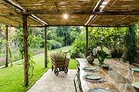 Laid dining table under the pergola