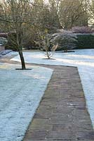 York stone paving by frosty lawns. 