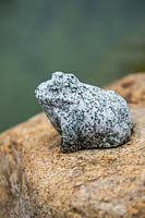 Small stone ornament on rock