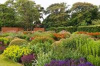 View over extensive perennial flower beds in wall garden 