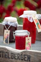 Tray of homemade raspberry and blackberry jams