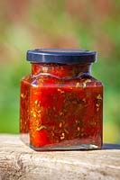 Jar of spicy caballero salsa relish made with tomatoes and chilli