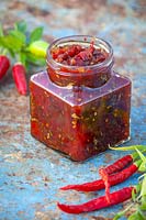 Jar of spicy caballero salsa relish made with tomatoes and chilli
