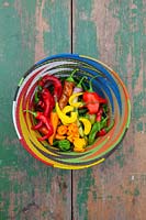 Mixed chilli peppers in a colourful basket