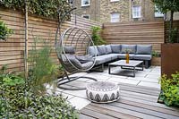 Modern Small Outdoor Room  with decking, seating area with a sofa and hanging chair