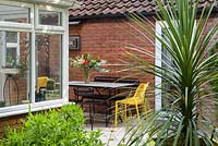 Small Modern Garden with metal chairs and table