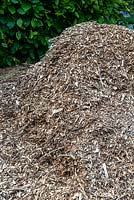 Heap of wood chippings awaiting use as mulching material - Open Gardens Day, Friston, Suffolk