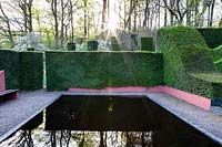  The Reflecting Pool and view to the wood and Wild Garden.  Hedges and columns of Taxus baccata 'Yew'.  