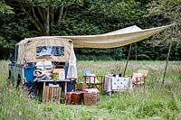 Landrover with awning and picnic setting
