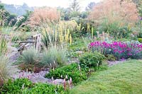 Colourful flowering perennial border at  Bluebell Cottage Gardens, Cheshire, UK