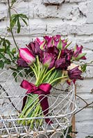 Bouquet of tulips in wire jardinere