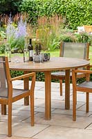 Dining furniture on patio with view to garden