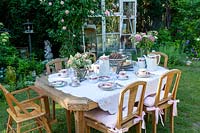 Outdoor table prepared for afternoon tea