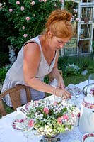 Woman setting a garden table