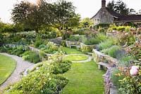 Terraces planted with roses, lavender, herbaceous perennials and shrubs