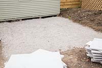 Foundation of compressed crushed concrete for patio. 
