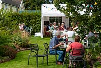 Visitors enjoying tea and refreshments at an Open Garden event. 