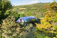 View of Welsh cottage amongst dramatic country views