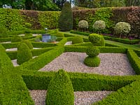 Formal country garden with hedges of Buxus sempervirens - Box - gravel in the beds