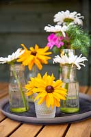 Cut flowers as decoration on patio table