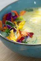Soup with edible flowers 