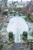 Walled town garden with snow