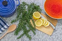 Materials and tools ready for making homemade scent with citrus and Salvia rosmarinus - Rosemary