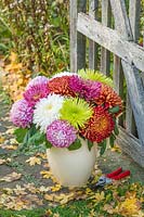 Chrysanthemums Sheer Red, Tula Green and Tula Purple in a vase