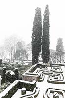 Formal Italian garden covered in snow. 