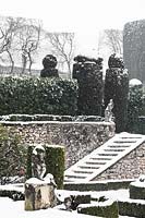 Topiary and steps covered in snow