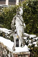 Stone statue in the snow