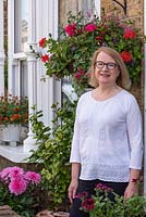 Caroline Cassell, a pharmacy development manager, and keen gardener who has made excellent use of limited space in her 11m x 4m town garden, with a side alleyway.