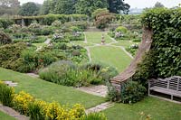 Formal garden, view across a large sunken parterre laid out with geometric borders edged with stone