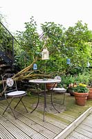 Table and Chairs in East London Town Garden by Earth Designs. 