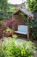 Gazebo and seat in East London Town Garden by Earth Designs.