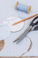 Gingham check fabric for decorating glass jar lids. 